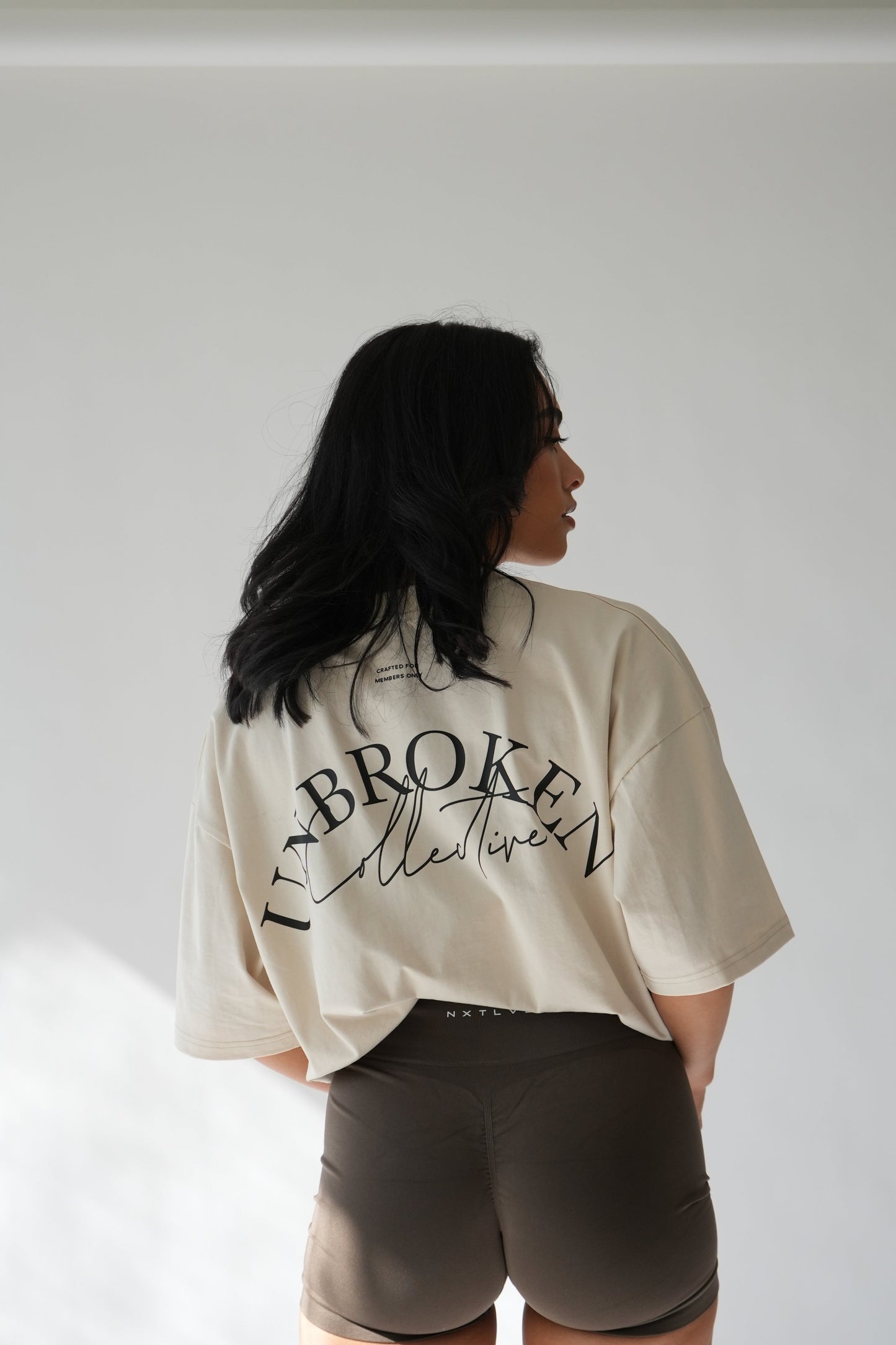 "UNBROKEN" OVERSIZED UNISEX TEE - LIGHT CREAM from NXTLVL ATHLETIC