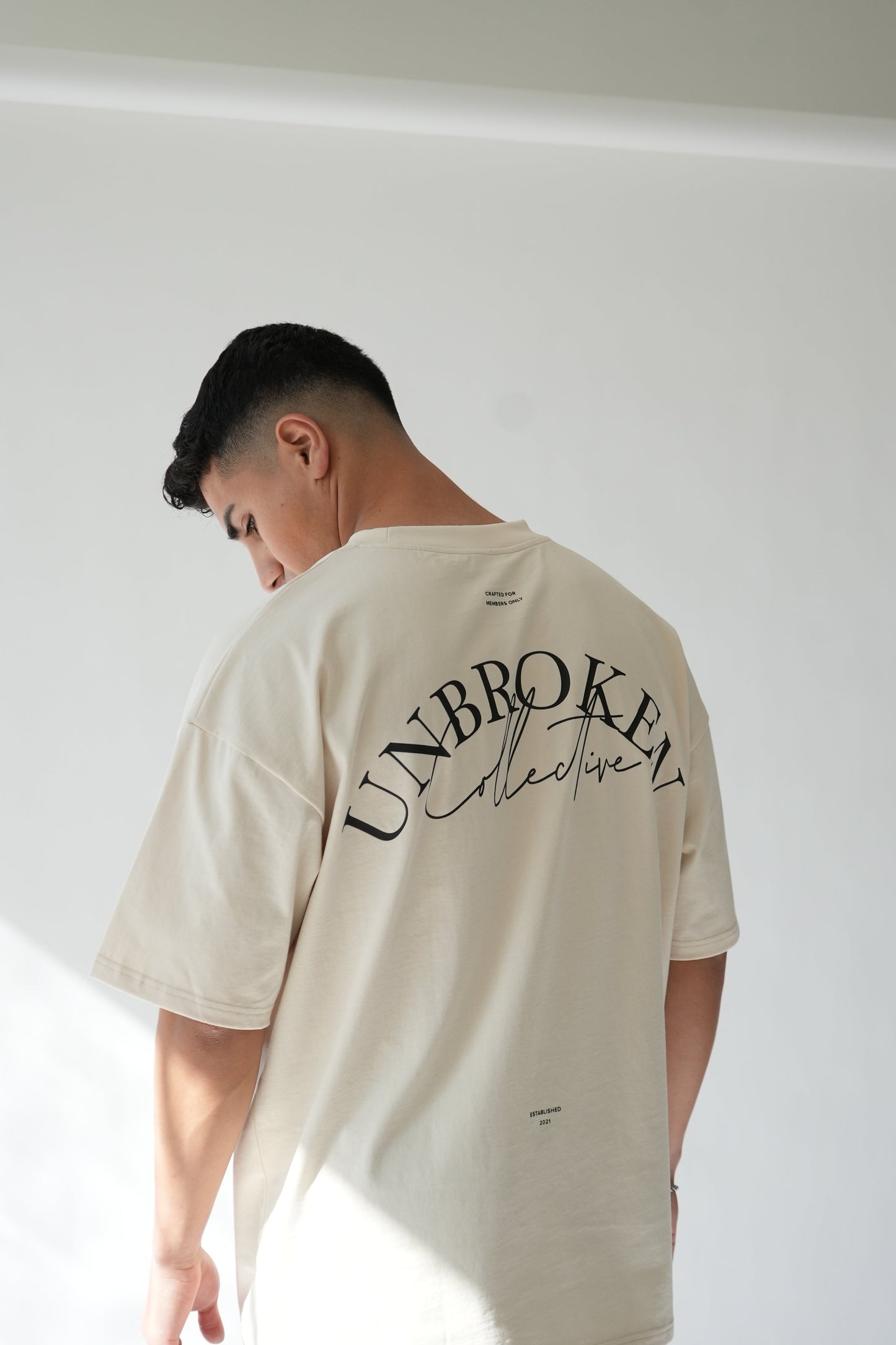 "UNBROKEN" OVERSIZED UNISEX TEE - LIGHT CREAM from NXTLVL ATHLETIC